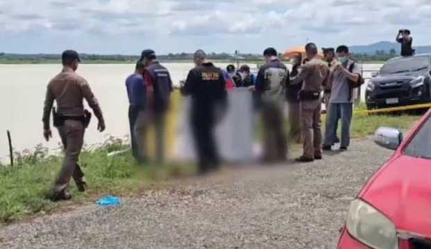 救援人員將漂浮在春武里水庫的黑色行李箱拖上岸，內藏女子屍體。（圖／Thai PBS World）