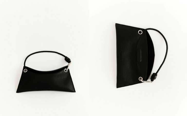 隨附的皮質掛手眼鏡包盒同樣講究,超級有質感的外型,加上磁吸開合與掛手式設計,讓收納也成為造型的一部分。(圖/品牌提供)