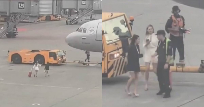 俄羅斯2名女子疑似因太晚抵達、錯過登機時間，竟拖著行李直闖停機坪，一路追向準備起飛的飛機，最後被工作人員帶離。（圖／翻攝X）
