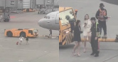 俄羅斯2名女子疑似因太晚抵達、錯過登機時間，竟拖著行李直闖停機坪，一路追向準備起飛的飛機，最後被工作人員帶離。（圖／翻攝X）