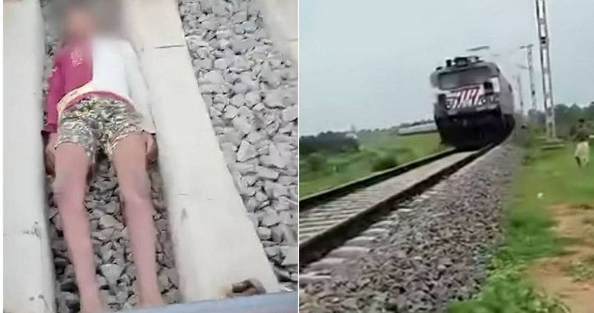 印度少年臥軌拍短影音，任由一列火車從上方急駛而過，場面險象環生。（圖／翻攝自YouTube）