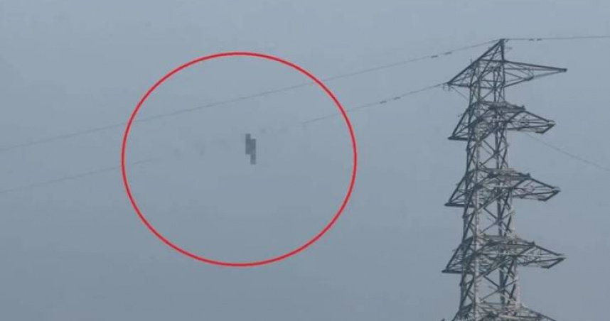 台電人員發現有人懸掛在高壓纜線上。（圖／翻攝畫面）