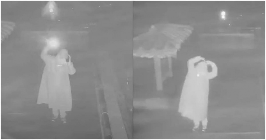 一名男子三更半夜穿著雨衣，頂著刺骨寒雨獨自在武嶺亭跳舞，且一待就是10小時，畫面曝光後，引起網友熱烈討論。（圖／擷取自YouTube／台灣即時影像監視器）